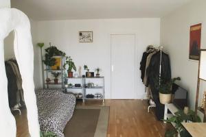 a room with white walls and a hallway with a door at Paris Skyview - Latin Quarter & Eiffel Tower in Paris