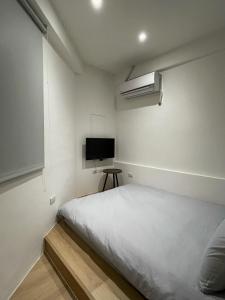 Postel nebo postele na pokoji v ubytování 無生居 Wu Sheng Stay