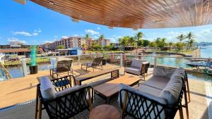 a patio with chairs and tables and a pool at WTS HOUSE BOAT in Brasilia