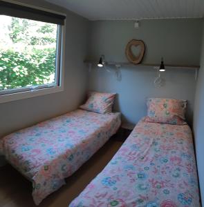 Postel nebo postele na pokoji v ubytování Chalet Hoenderloo Den