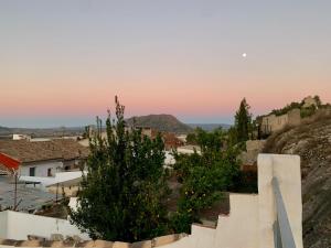 a view of a town with stairs and trees at Fortress Jacuzzi Suites in Xàtiva