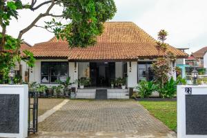 a house with a tile roof at Griya Merbabu Asri Homestay (up to 14pax @ Salatiga central) in Salatiga