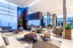 a lobby of a hotel with chairs and tables at Hilton DoubleTree Bogotá Salitre AR in Bogotá