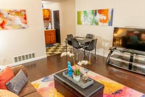a living room with a couch and a table at Modern Chic 2-Bedroom Apartment in Atlanta