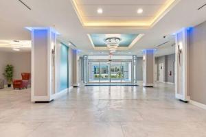 a large lobby with a large room with a hallway at Oceanside Duo - Double Room, Water Views, Pool & Beach Access, Free Parking in Daytona Beach