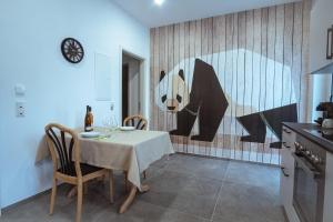 a dining room with a table with a bear on the wall at Neue Loft im alten Kelterhaus - Urlaub im Wein- und Ferienort Bekond in Bekond
