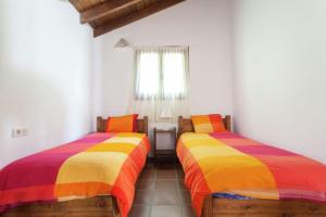 Giường trong phòng chung tại Montemateo finca Privada