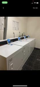 a counter in a room with two washing machines at Marco Polo Beach Resort Condo with balcony in Sunny Isles Beach