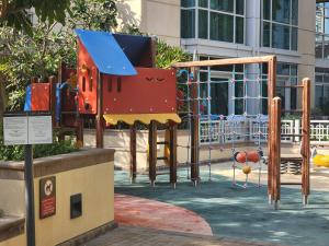 a playground in a park with a slide at Downtown Oasis, Burj Khalifa Views, Luxury Amenities in Dubai