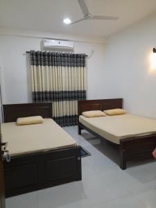 Hotel Sanhida Polonnaruwa 객실 침대
