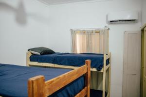 a room with two bunk beds and a closet at InstaLate Hostel in Santa Fe