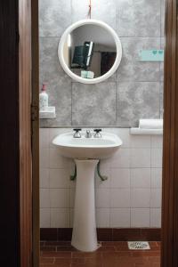 a bathroom with a sink and a mirror at InstaLate Hostel in Santa Fe