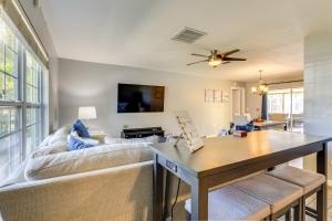 a living room with a couch and a table at Sarasota Home with Heated Pool 3 Mi to Airport! in Sarasota