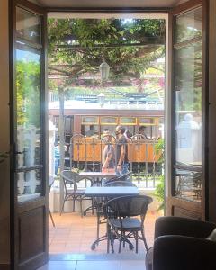 an open door to a patio with a train outside at Sol Port Soller in Port de Soller