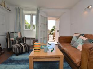a living room with a couch and a coffee table at 2 Bed in Charmouth DC077 in Charmouth