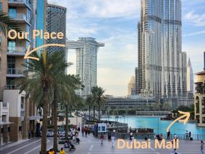 a view of a city with tall buildings at Downtown Oasis, Burj Khalifa Views, Luxury Amenities in Dubai