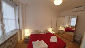A bed or beds in a room at Appartamenti Reali Bonaccini