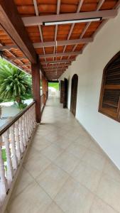 a corridor of a house with a wooden ceiling at Casa Praia dos Sonhos in Itanhaém