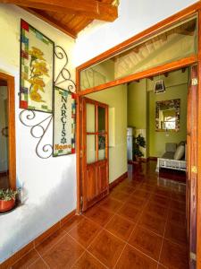 an open door to a room with a living room at Narciso Home in Cafayate