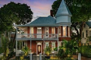 a large house with a turret on top of it at Carriage House at Grand Maloney by Brightwild in Key West