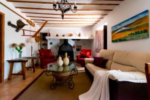 a living room with a couch and a table at Finca & SPA Vereda Real in Alcaraz