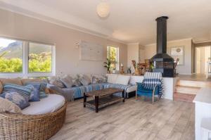 a living room with a couch and a fireplace at The Sea Soul in Cape Town