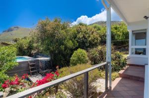 a view from the balcony of a house with flowers at The Sea Soul in Cape Town
