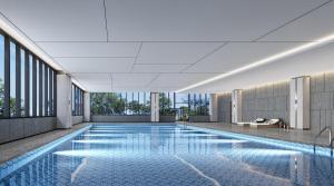 a swimming pool in a building with windows at Crowne Plaza Lanzhou New Area, an IHG Hotel in Lanzhou