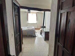Postel nebo postele na pokoji v ubytování Casa Rural El Reloj