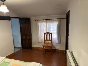 Postel nebo postele na pokoji v ubytování Casa Rural El Reloj