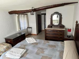 Postel nebo postele na pokoji v ubytování Casa Rural El Reloj