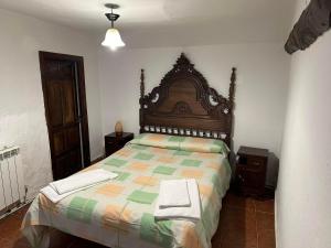 Postel nebo postele na pokoji v ubytování Casa Rural El Reloj