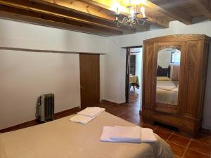 Postel nebo postele na pokoji v ubytování Casa Rural El Reloj