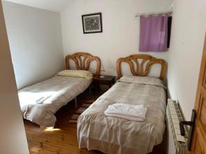 Postel nebo postele na pokoji v ubytování Casa Rural El Reloj