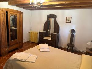 Postel nebo postele na pokoji v ubytování Casa Rural El Reloj