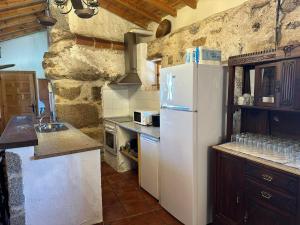 Kuchyň nebo kuchyňský kout v ubytování Casa Rural El Reloj