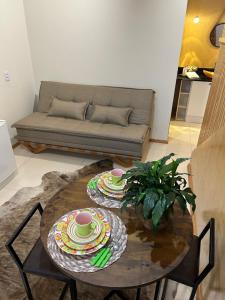 a living room with two tables and a couch at Lofts Urbano in Urubici