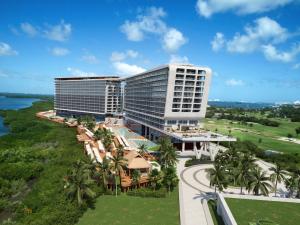 an aerial view of a hotel with palm trees at Hyatt Vivid Grand Island in Cancún