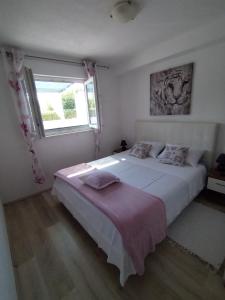 Postel nebo postele na pokoji v ubytování Apartmani Kulin 2