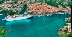 a cruise ship is docked in a harbor at Apartment Pela in Kotor