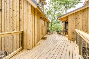 a wooden porch of a house with a deck at The Spruce in Treehouse Grove at Norton Creek in Gatlinburg