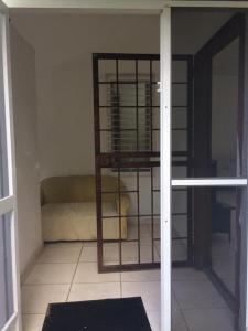 a room with a cage in the corner of a room at yayaya coronado playa exelente precio in Playa Coronado