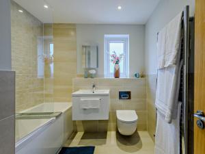 a bathroom with a toilet and a sink at 3 Bed in Lulworth Cove 91200 in West Lulworth +18 photos