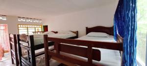 Двухъярусная кровать или двухъярусные кровати в номере MAGIA DEL MAR HOTEL - RESTAURANTE - BAR