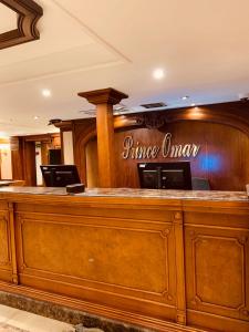 a bar in a hotel with a wooden counter at Prince Omar Nile Cruise - Luxor to Aswan in Aswan