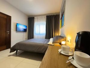 A bed or beds in a room at BaySide1 Marsaxlokk Malta