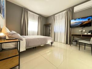 A bed or beds in a room at BaySide1 Marsaxlokk Malta