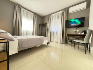 A television and/or entertainment centre at BaySide1 Marsaxlokk Malta