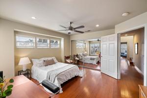 a bedroom with a bed and a ceiling fan at 8A Peaceful oasis in Huntington Beach