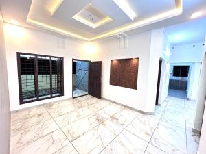 a living room with marble flooring and a coffered ceiling at ENTIRE HOUSE at KOLLAM DISTRICT in Kottiyam